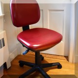 F37. Red desk chair. 